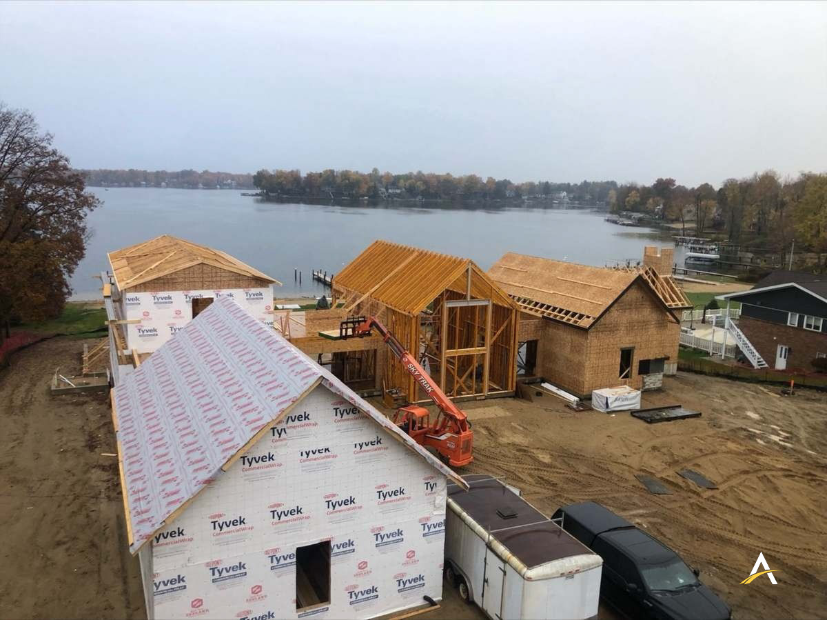 Aerial view of house wrap and lakefront setting