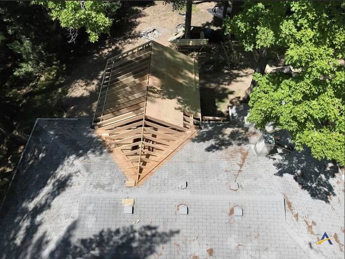Aerial view of roof trusses tying into the existing roofline