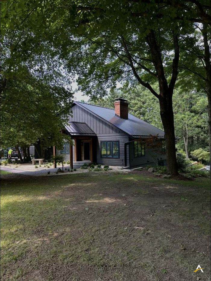 Completed house exterior renovation with new entry