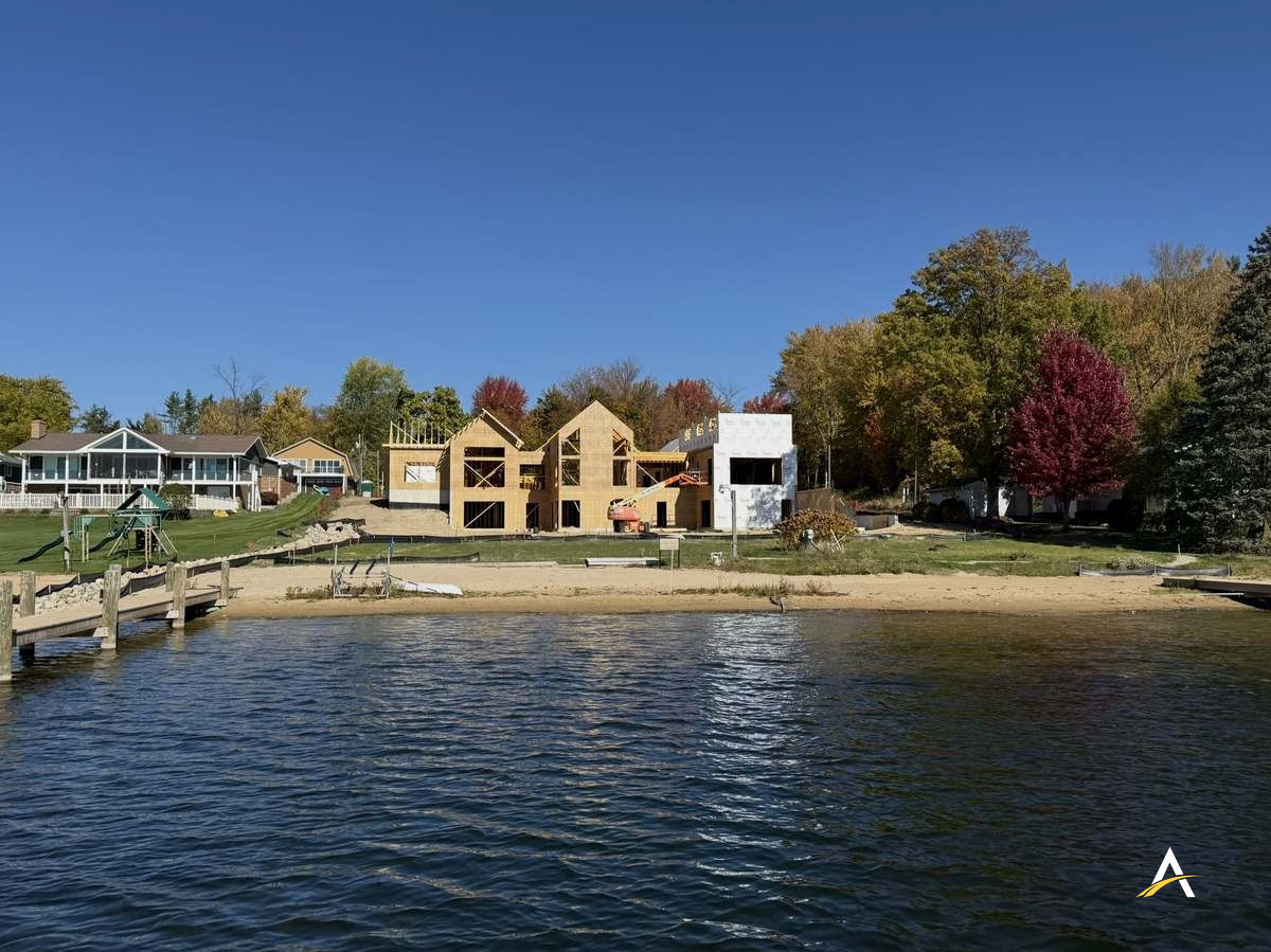 Framed home viewed from the lake