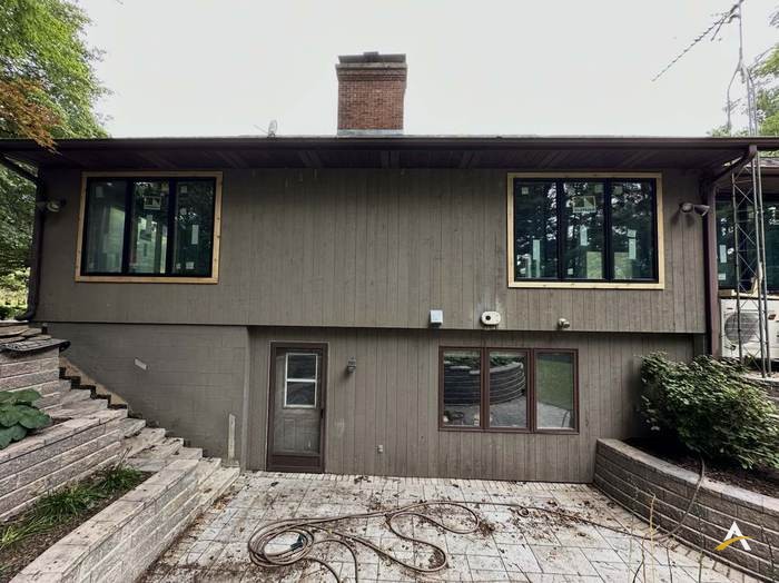 Original siding and windows before replacement