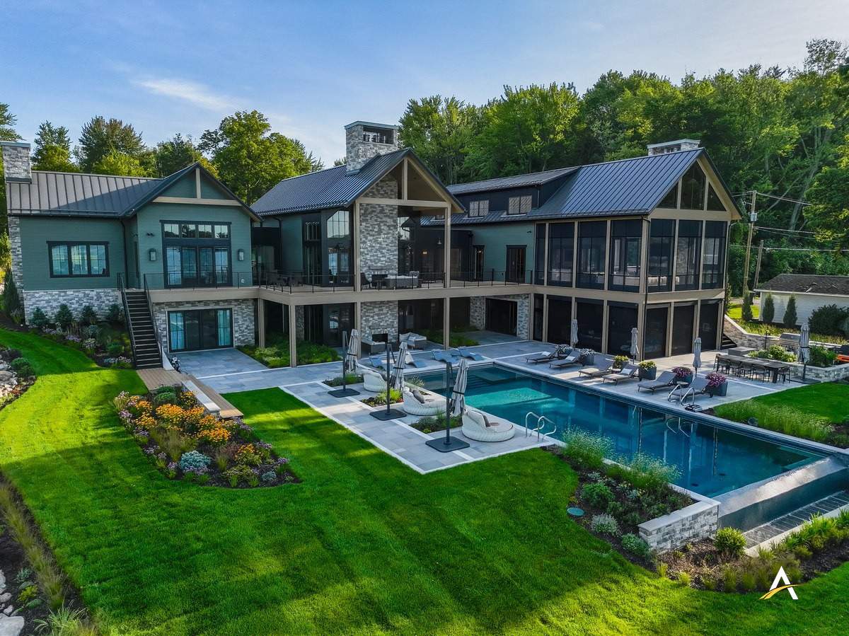 Rear exterior and pool of the completed lakefront home