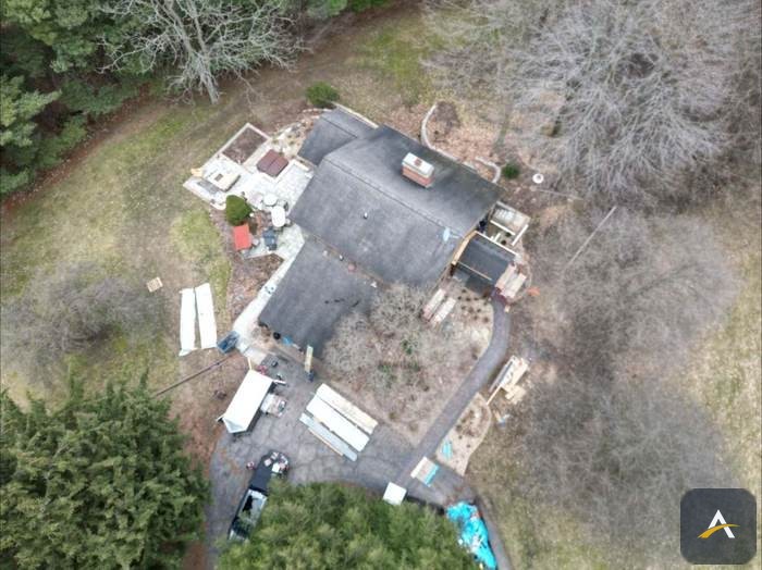Worn shingle roof before replacement